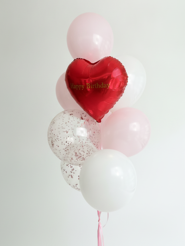 A bouquet of hydrangeas with a set of balloons
