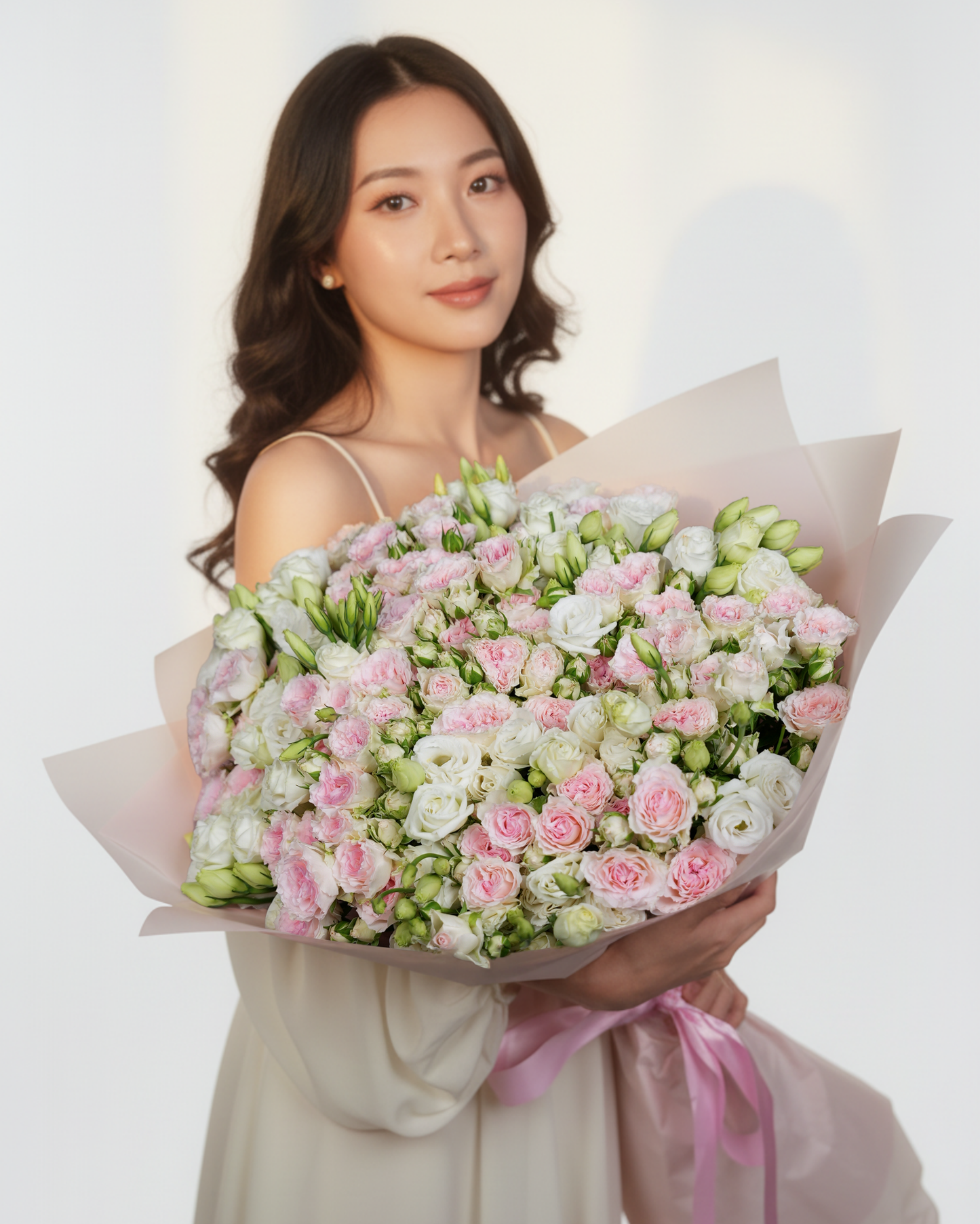 Eustomas and spray roses