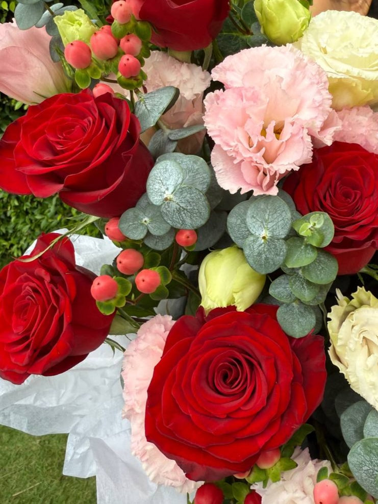 composition of roses and eustomas in box