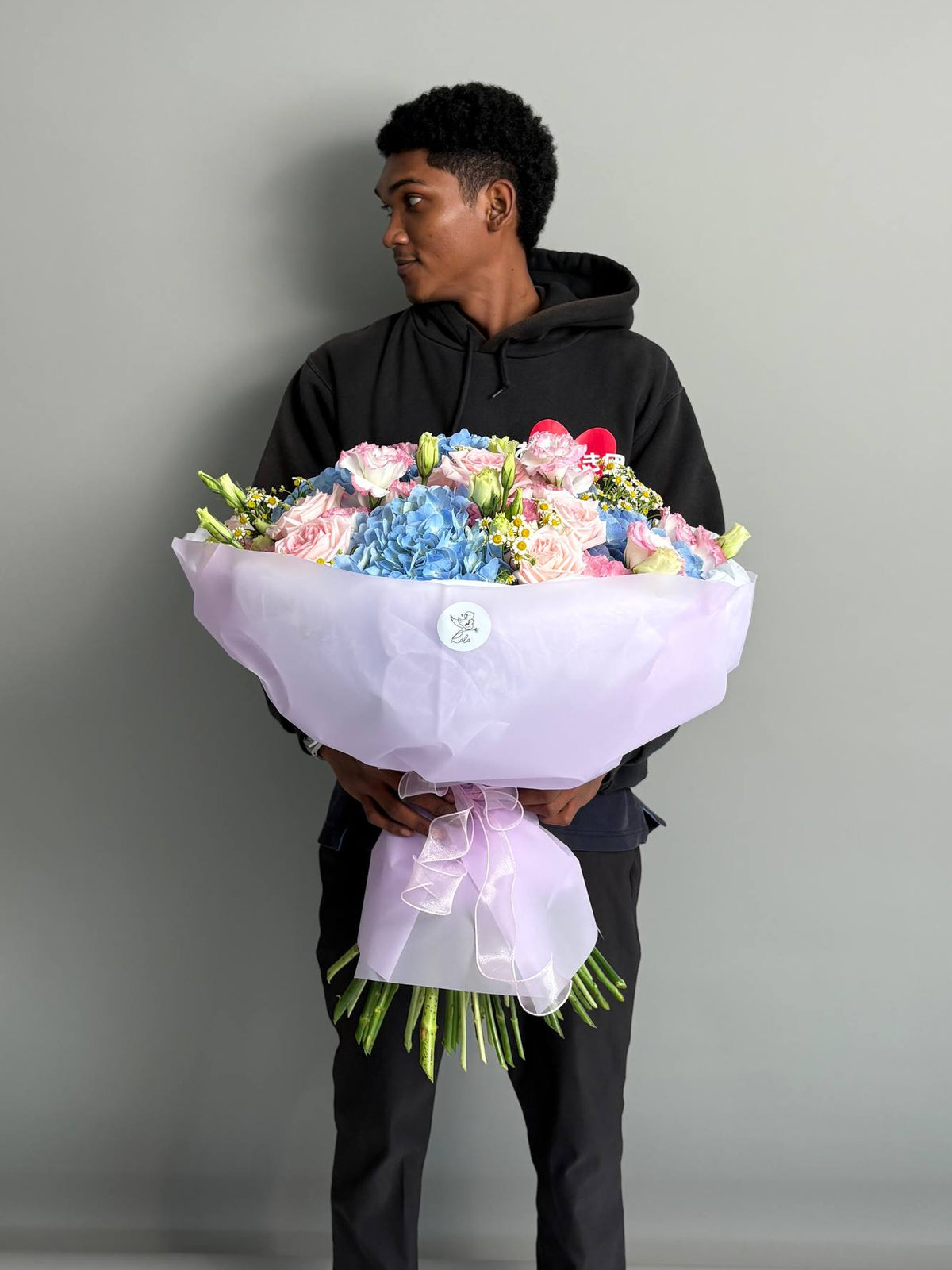 A bouquet with hydrangeas, peony roses, and eustoma. Size L