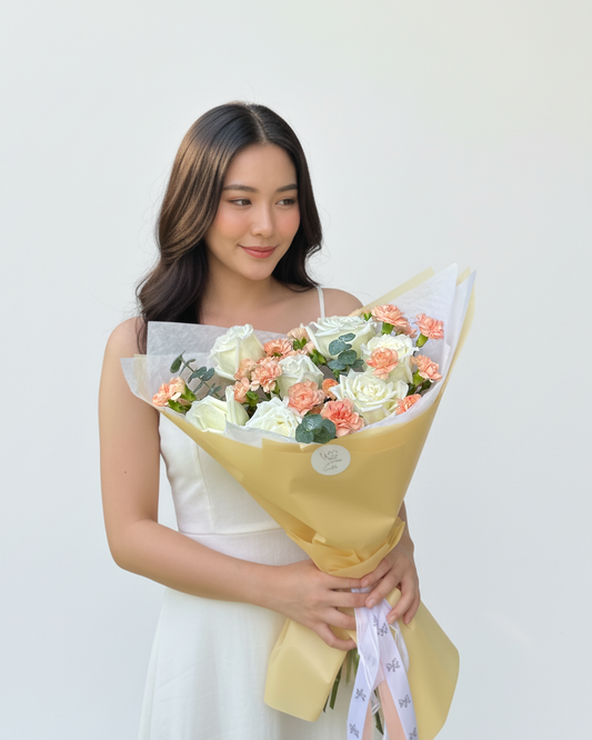White rose with dianthus bush