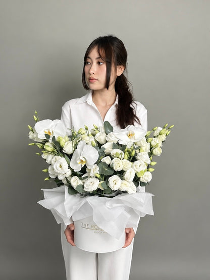 Box with Eustoma and orchid white