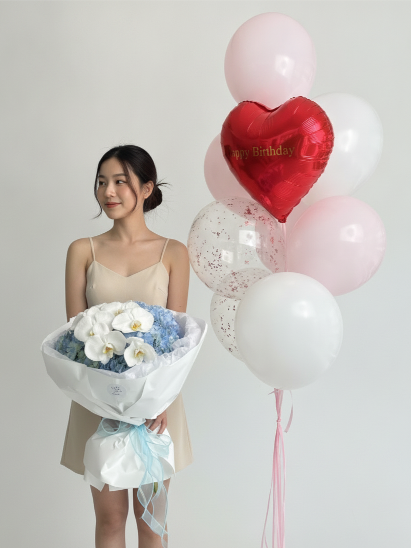 A bouquet of hydrangeas with a set of balloons
