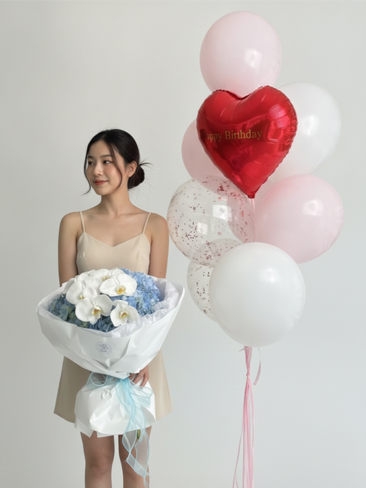 A bouquet of hydrangeas with a set of balloons