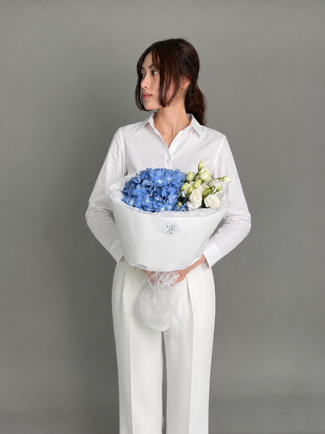 Mini bouquet with blue hydrangea and eustomas