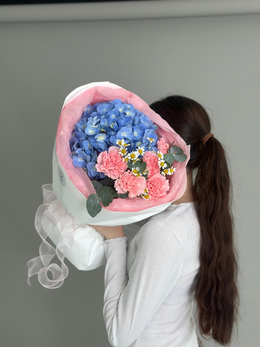 Mix bouquet with blue hydrangeas