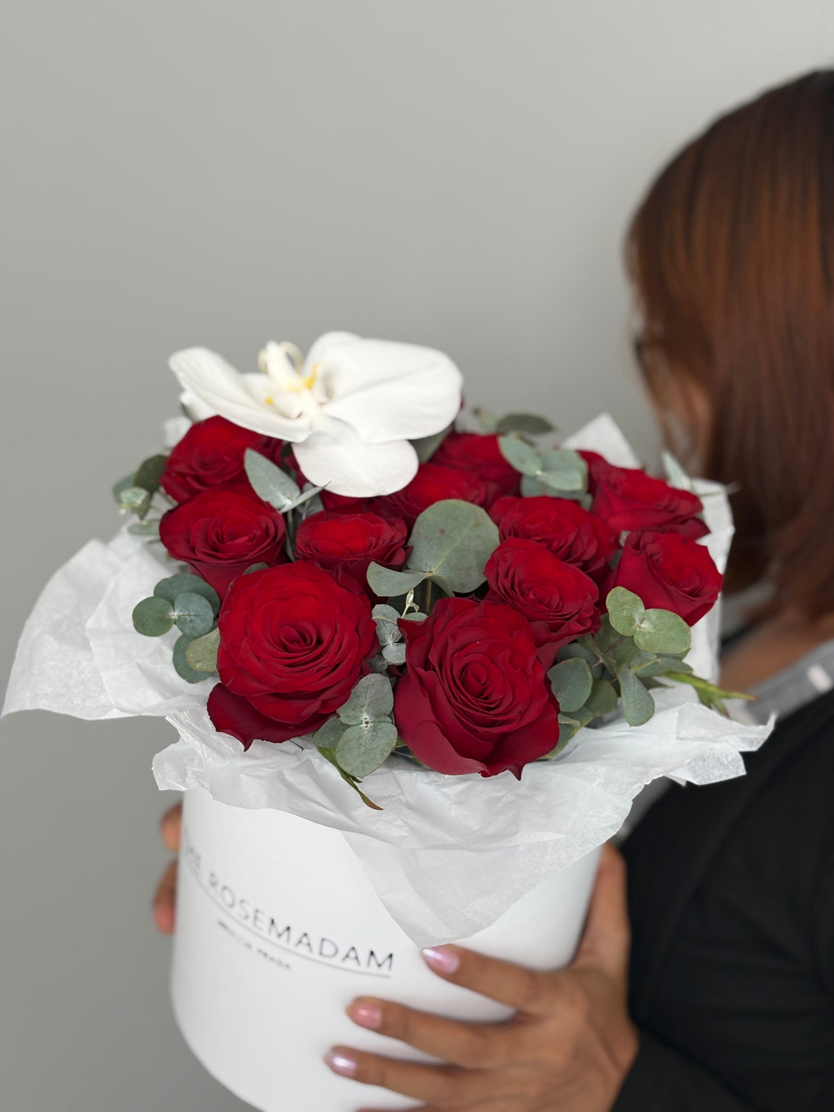 Box with 15 red rose and orchid