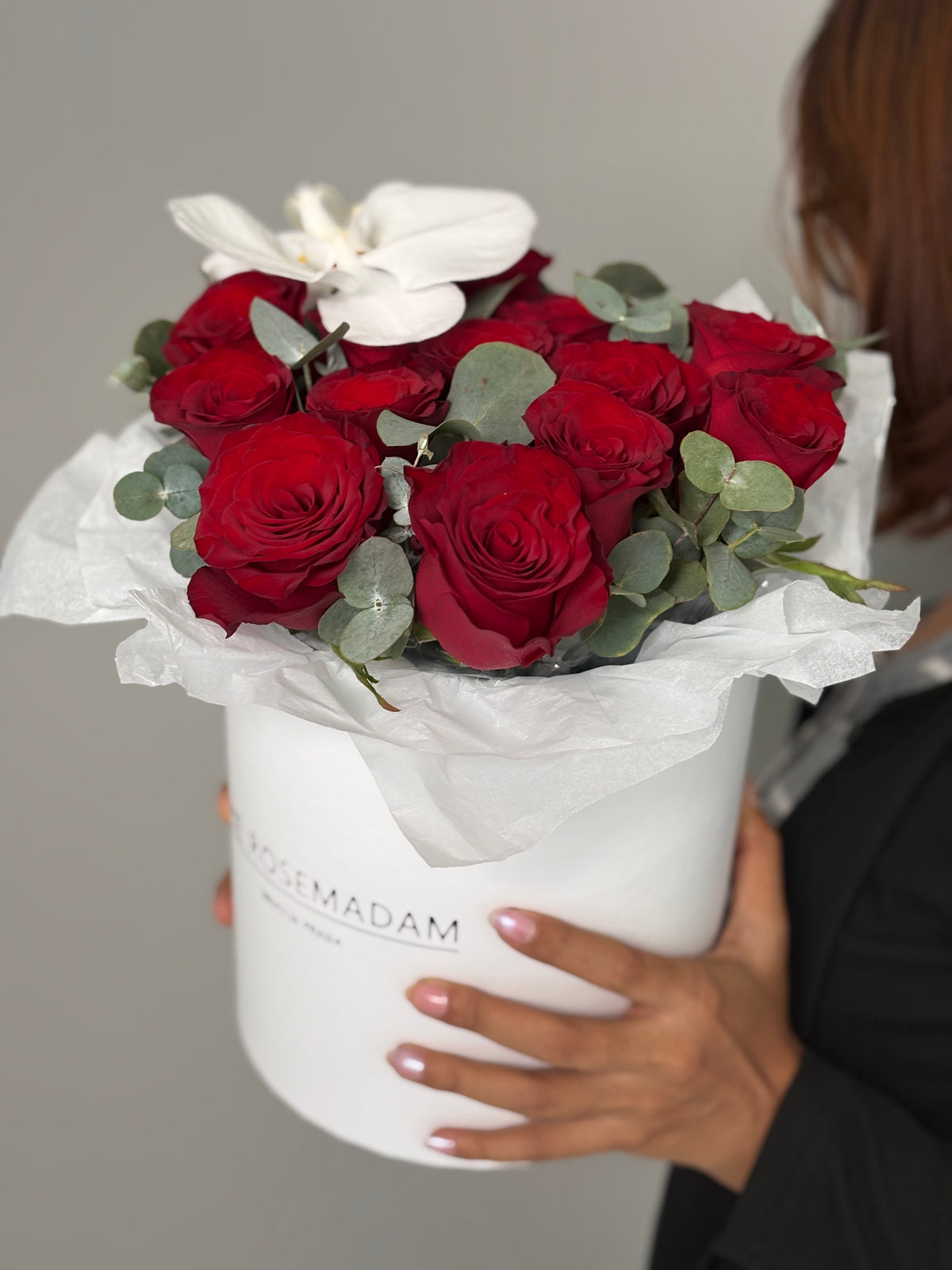 Box with 15 red rose and orchid