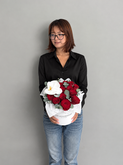Box with 15 red rose and orchid