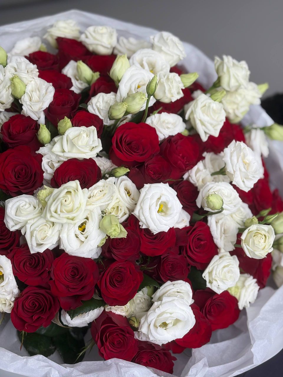A bouquet of red roses and eustoma. Size XL