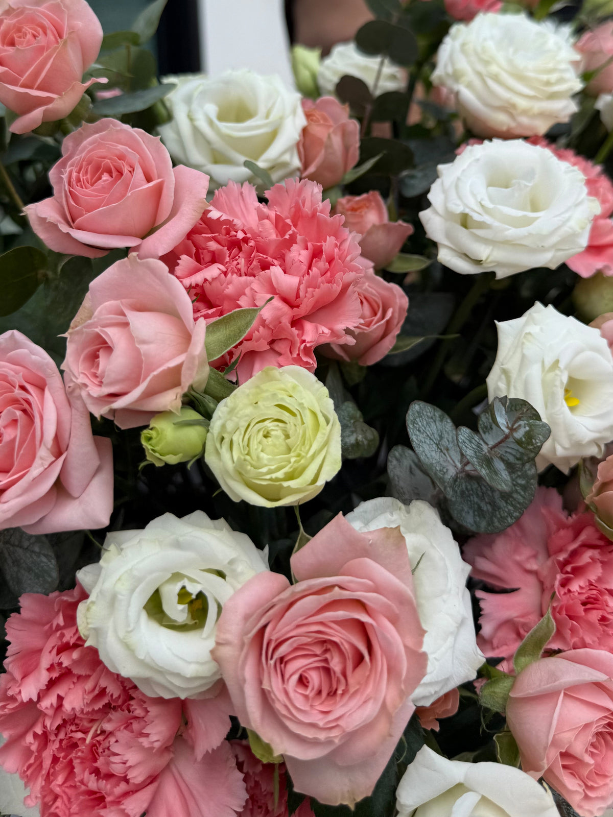 Author's composition with eustoma and bush roses