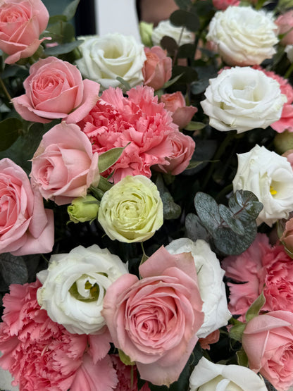 Author's composition with eustoma and bush roses